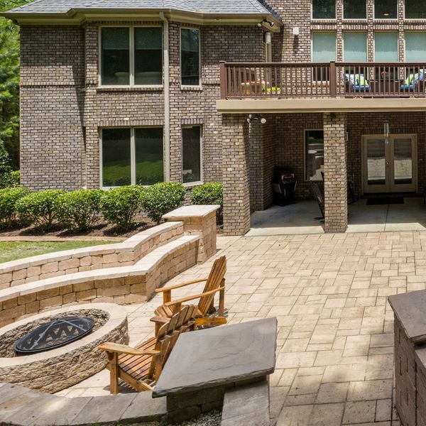 large patio stone fire pit and walls