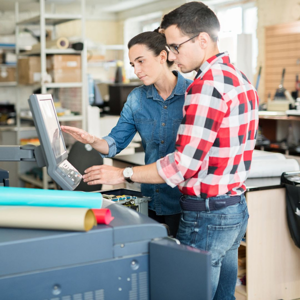 two employees looking at screen