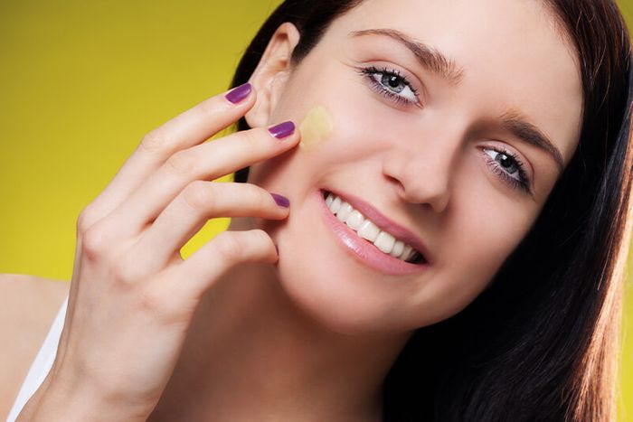 woman applying facial butter