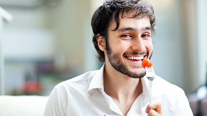 man eating with nice teeth