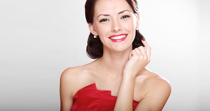woman smiling in red dress