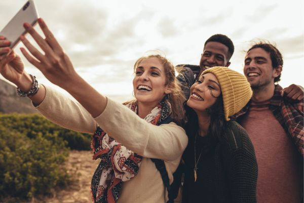 travel group taking selfie