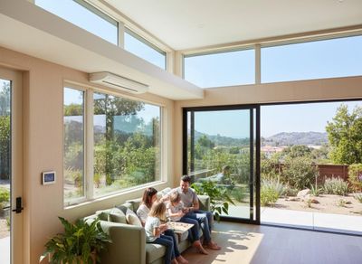 Family Relaxing in Modern Living Room with Scenic Views