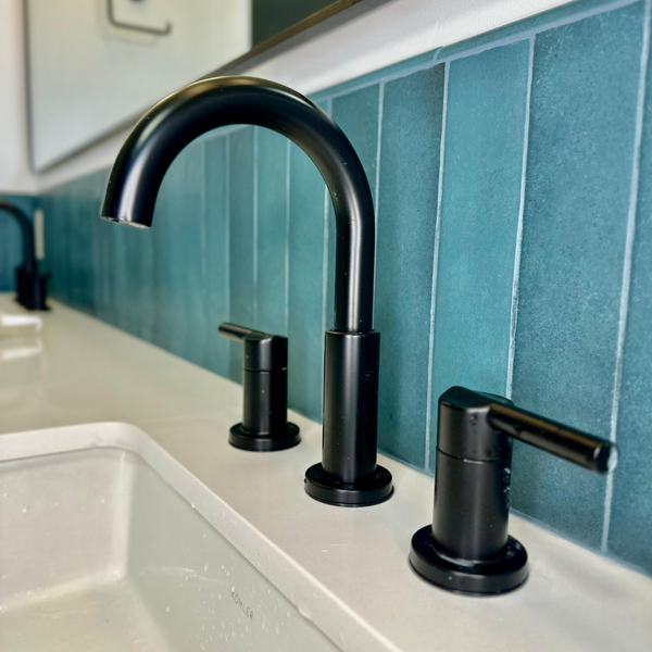 close up of black bathroom faucet 