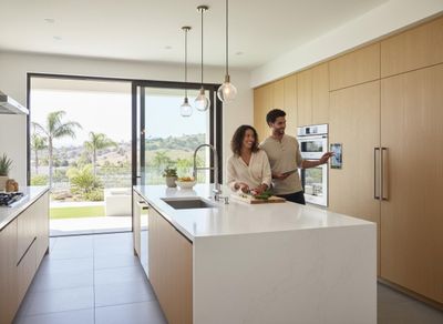 Couple using smart kitchen technology