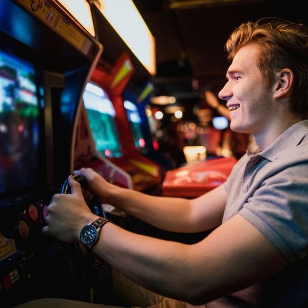 person playing arcade game