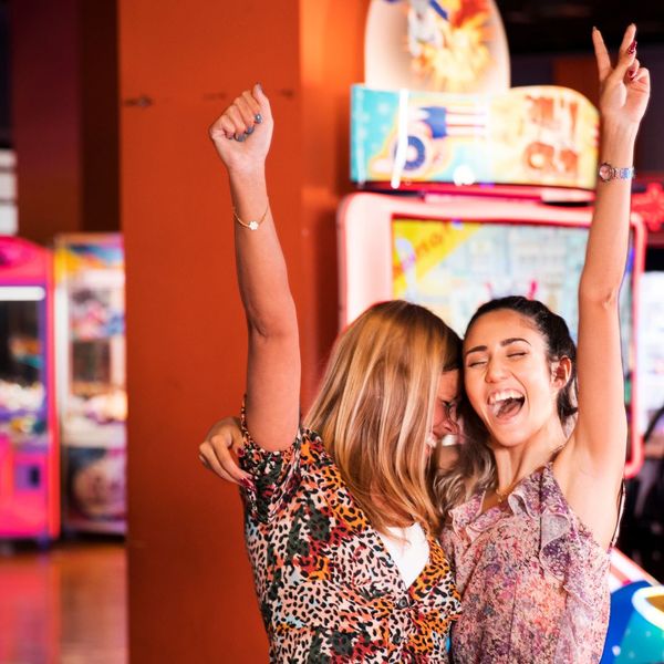 girls smiling in arcade