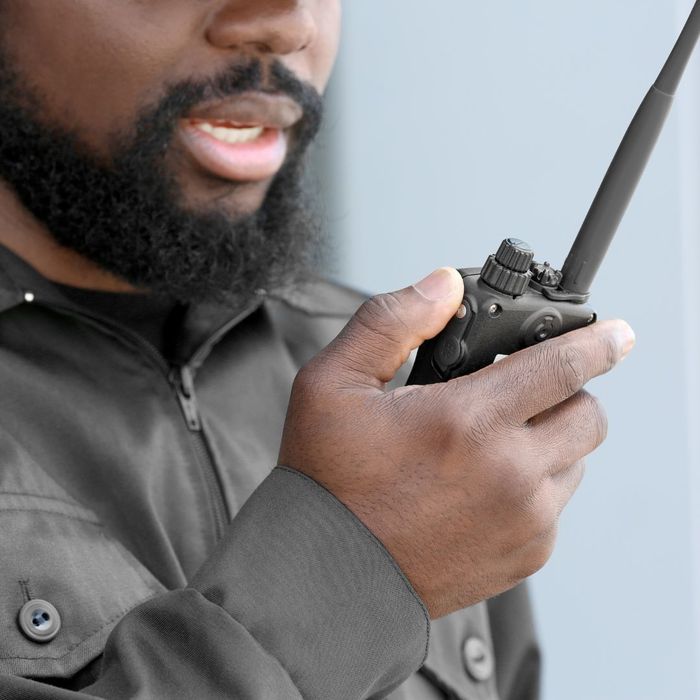 security officer talking into radio