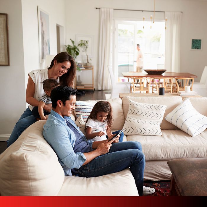 Family sitting on couch together