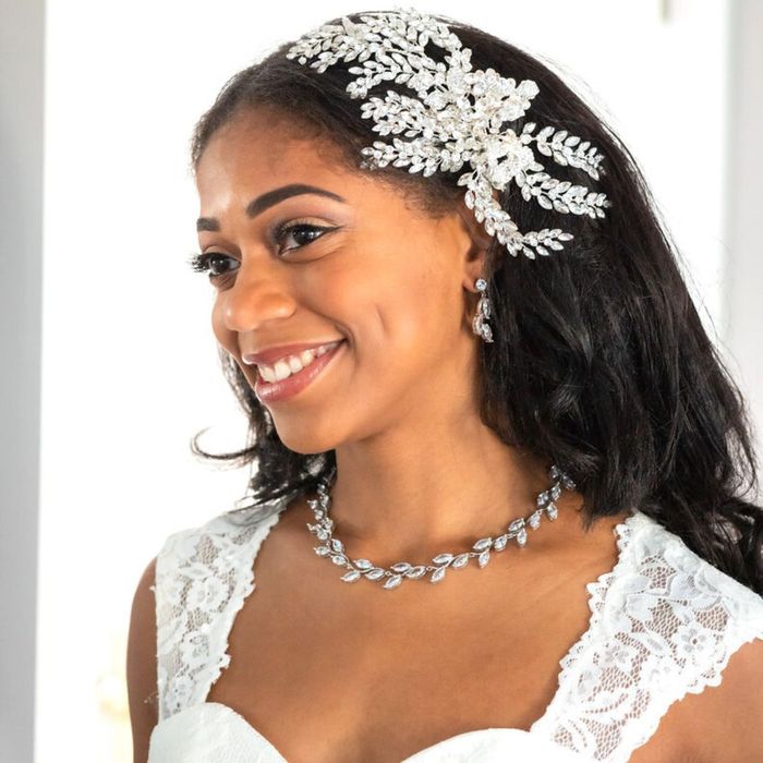 bride with a floral necklace and matching earrings