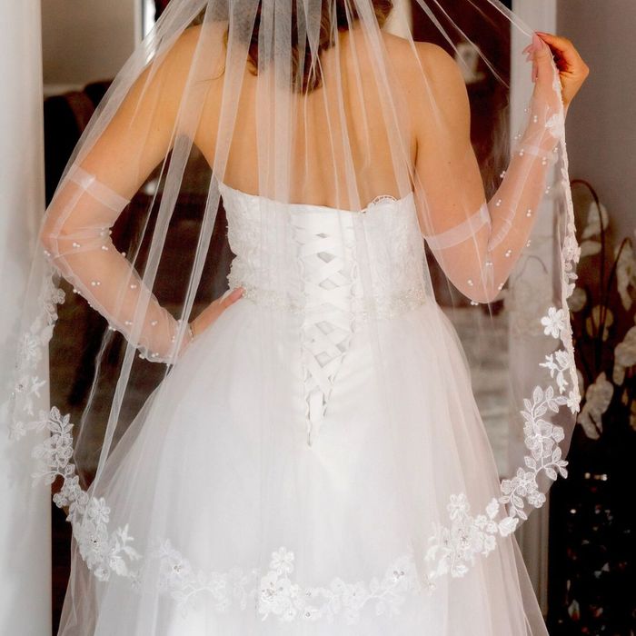 bride with a floral lace veil bride with a floral lace veil