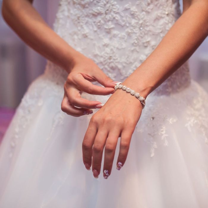 woman touching a crystal bracelet