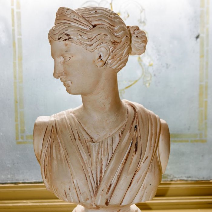 a Greek marble bust wearing a tiara