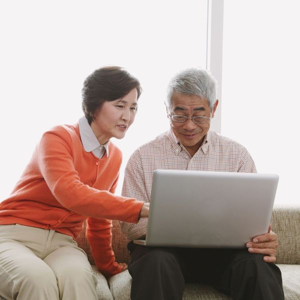 Couple looking on their computer at Medicare plans