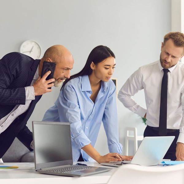 insurance agents looking at a computer