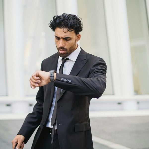 businessman checking his watch