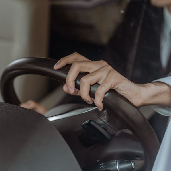 Hands on a steering wheel
