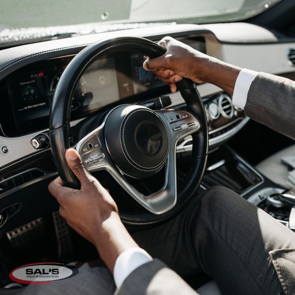 corporate transportation chauffeur driving safely through traffic