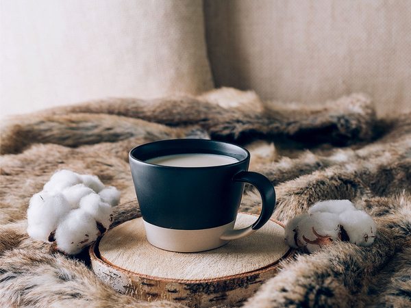 cup of coffee on blanket with cotton balls