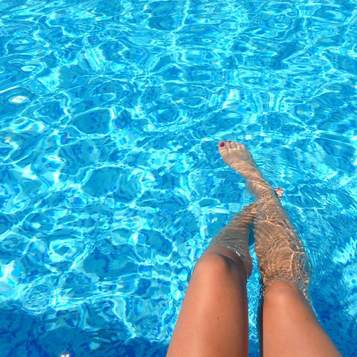 dunking legs in a swimming pool