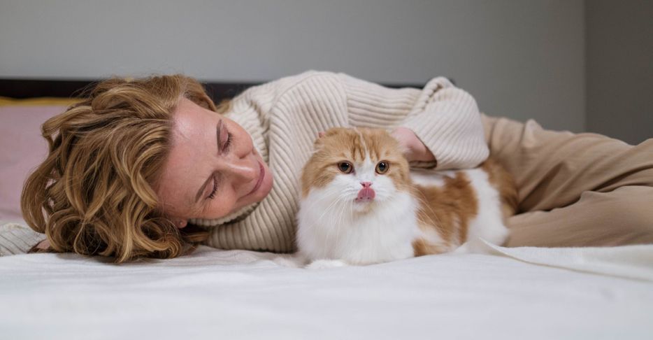 woman petting her cat