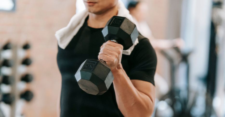 man lifting weights