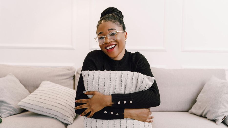 woman sitting on her couch