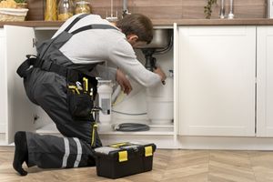 plumber fixing pipes under sink plumber fixing pipes under sink