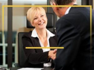 woman shaking hands with lawyer