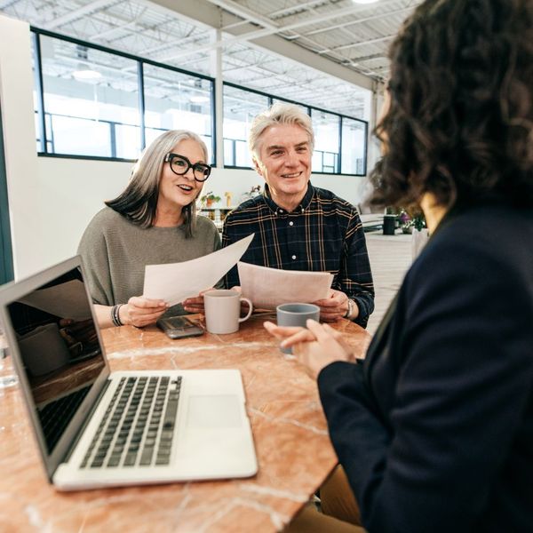 couple talking to insurance agent