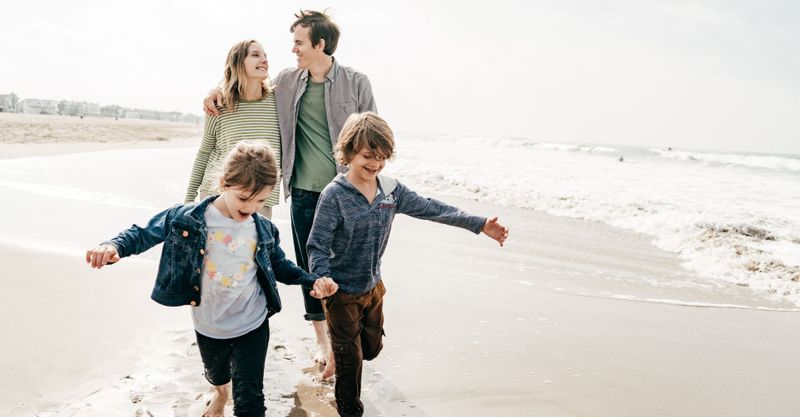 family walking on beach