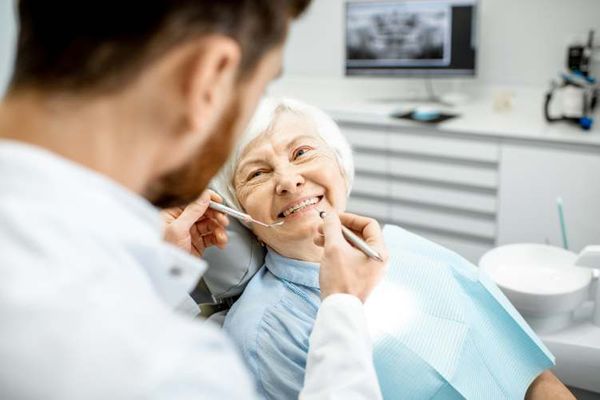 elderly woman at dentist