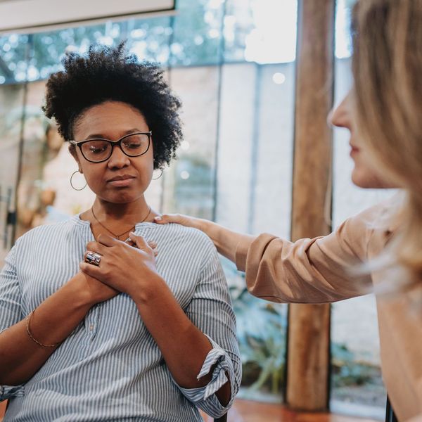 person getting emotional support from counselor