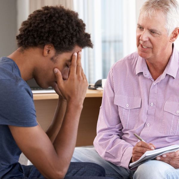 patient with head in hands at counseling session