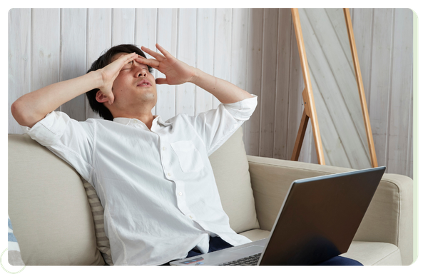 stressed-out young man using laptop