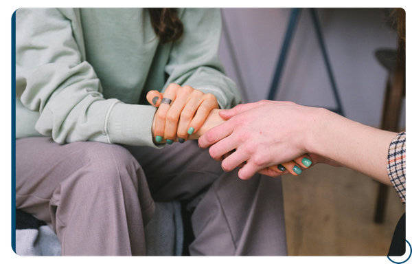 holding hands to soothe and reassure