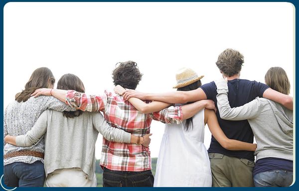 group of people with arms around each other