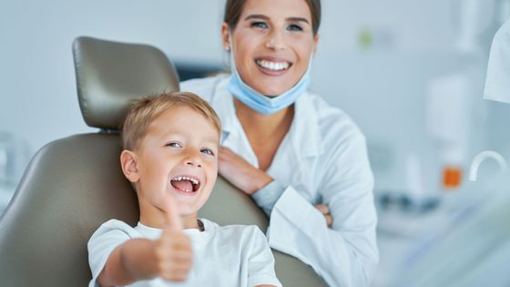 happy kid with dentist
