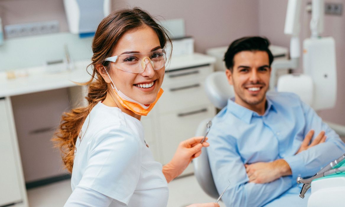 man smiling with dentist