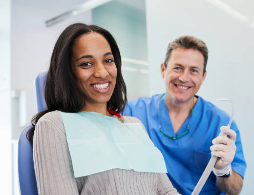 woman with dentist smiling