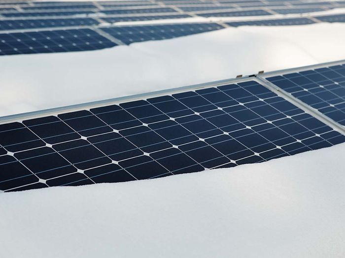 solar panels covered with snow