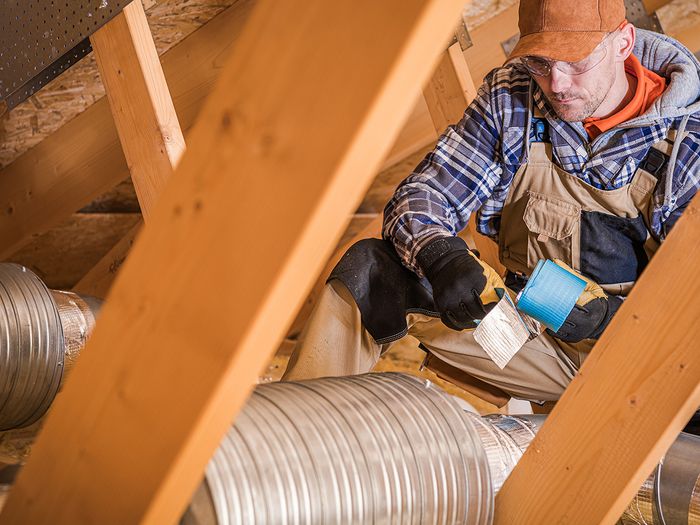 A contractor installs a residential eShield system.