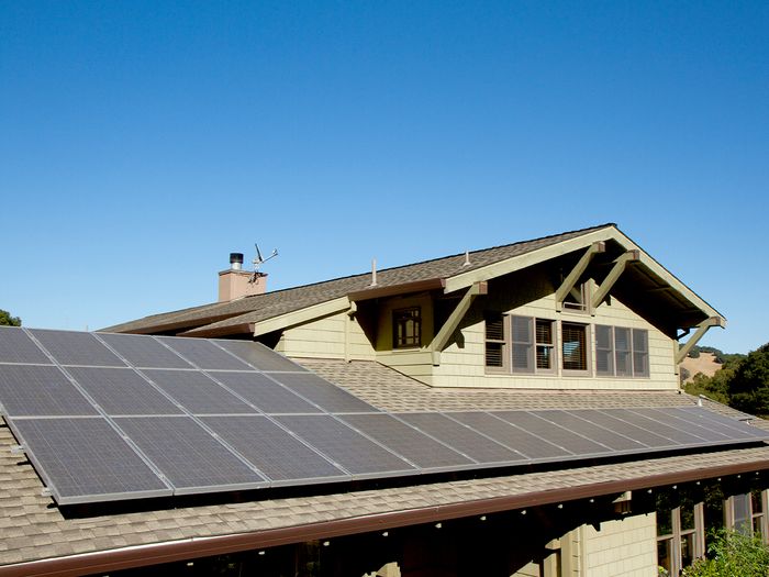 A large home with rooftop solar panels.