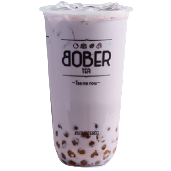 A beautiful, pastel purple Taro Latte served over ice. This creamy caffeine-free favorite includes a layer of honey boba pearls at the bottom of the signature Bober Tea cup.