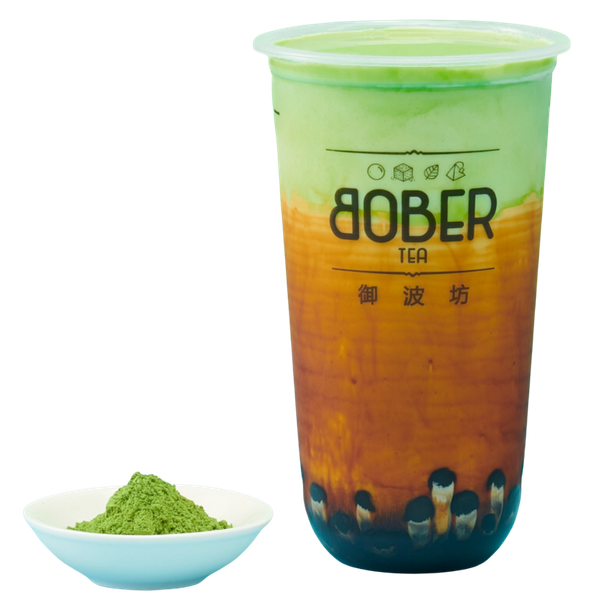A vibrant Matcha Brown Sugar Latte showing a striking contrast between the earthy green matcha top layer and the deep amber brown sugar syrup and boba pearls at the bottom.
