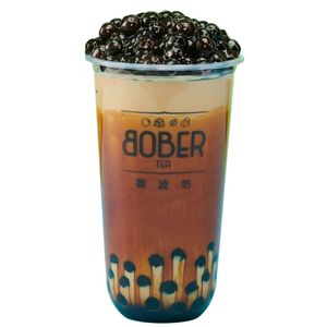 A rich Brown Sugar Boba Fresh Milk featuring signature syrup "tiger stripes" around the cup and a double portion of glossy, dark brown boba pearls piled high at the top.