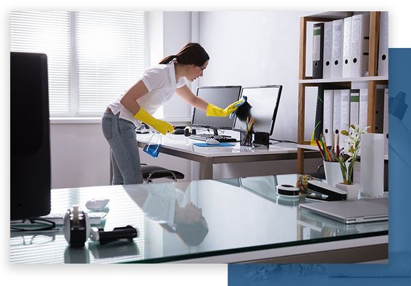 Woman cleaning computer in home office