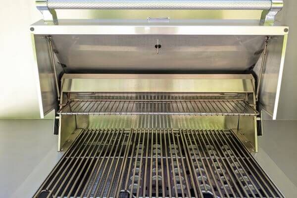 an open BBQ grill, showing clean grates