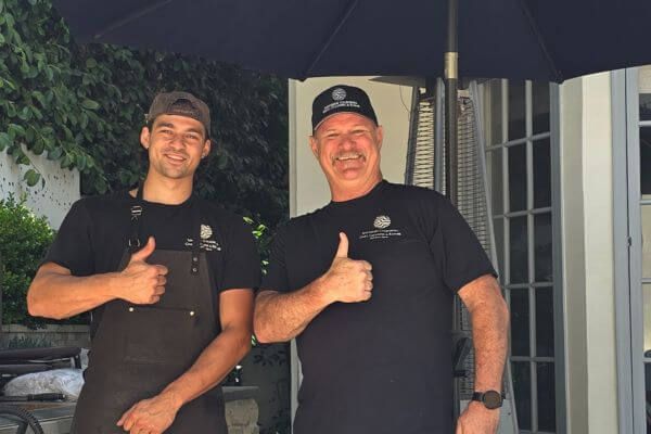 professional grill cleaners giving a thumb's up