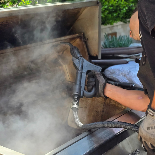grill being steam cleaned